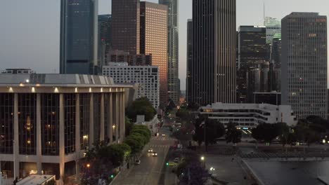 Aerial-descending-shot,-drone-showing-the-skyscrapers-of-the-financial-district,-downtown-of-Los-Angeles