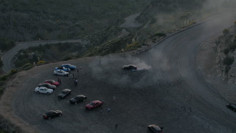 Done-shot-of-muscle-and-sports-cars-doing-doughnuts-and-burnouts-with-a-car-club-in-the-Angeles-National-Forest-in-Southern-California-during-Sunset