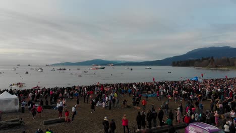 Various-drone-shots-at-English-Bay-near-downtown-Vancouver,-BC-during-Polar-Bear-2019-event