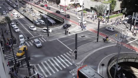 Buses-and-cars-during-traffic-on-Sao-Paulo-Avenida-Paulista-during-day,-Brazil