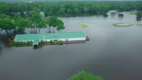 Pine-Bluff,-Regional-park-building-flooded-overhead-shot