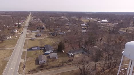 A-left-to-right-aerial-view-pan-of-the-skyline-including-a-water-tower-of-Odin-Illinois---a-rural-town-in-Southern-Illinois