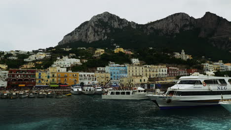 A-view-captured-upon-a-boat-while-leaving-Capri,-Italy-in-the-summertime