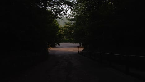 Silhouette-Of-Car-Driving-In-The-Dark