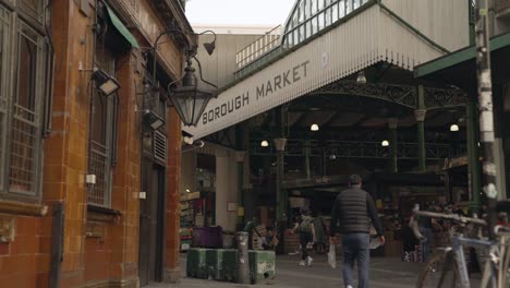 Borough-Market-main-entrance-with-a-train-passing-by-in-the-horizon