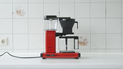 Wide-shot-of-a-red-vintage-coffee-maker