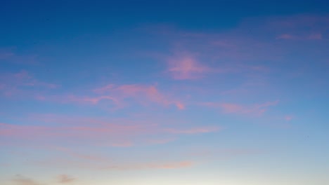 4k-time-lapse-of-light-pink-clouds-at-sunrise,-beautiful-background-footage-great-for-over-lays-of-text-for-intro,-copy-space,-shot-in-marbella,-spain