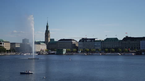 People-enjoy-rowing-and-paddling-at-binnenalter-lake-in-Hamburg,-Germany-at-sunny-day