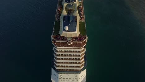 Aerial-close-up-view-from-the-stern-to-the-bow-of-the-cruise-ship-when-sailing-away-4K