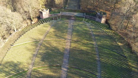 Panning-view-to-steps-covered-in-moss-at-historic-open-air-theater-in-Heidelberg-Germany