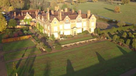 Aerial-rising-view-of-Godinton-House-and-gardens,-Ashford,-Kent,-UK