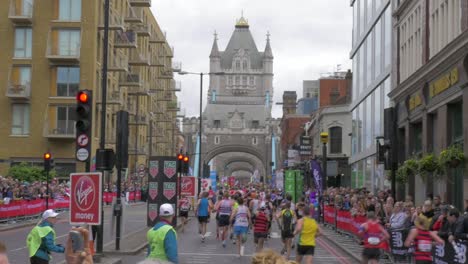 Wide-shot-of-London-marathon-runners-crossing-London-Bridge