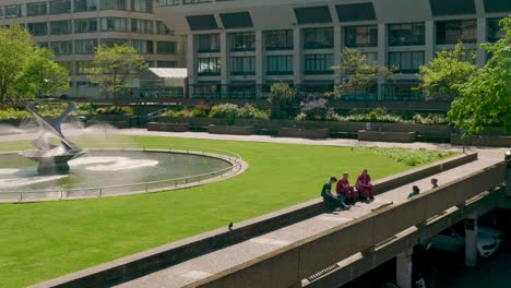 Wide-shot-of-NHS-staff-during-lunch-break,-less-than-two-meters-apart,-social-distancing