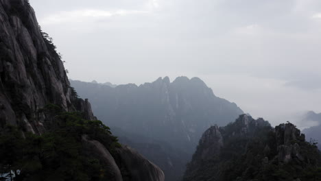 Huangshan--aerial-reveal-over-mountainous-landscape,-Anhui-China