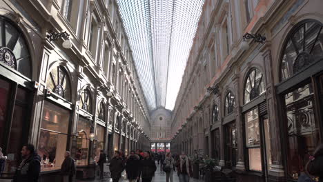 The-popular-Galeries-Royales-Saint-Hubert-in-central-Brussels,-Belgium---tilt-down