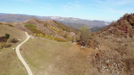 Autumn-landscape-in-a-Romanian-remote-village-up-in-the-mountains,-drone-footage