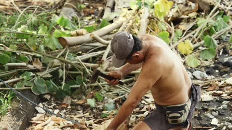 Balinese-man-hand-crafting-a-traditional-jukung-fishing-boat