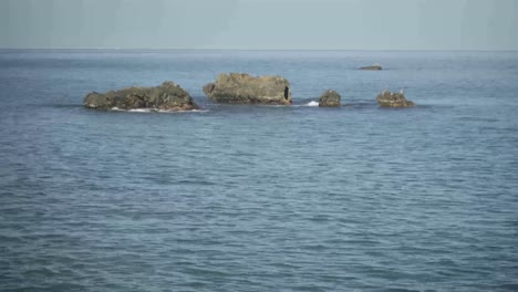 Rocks-on-the-blue-calm-caribbean-sea