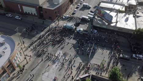 Rotating-drone-video-of-protesters-in-the-street-being-blocked-by-police-from-travelling-west-on-111th-and-Western