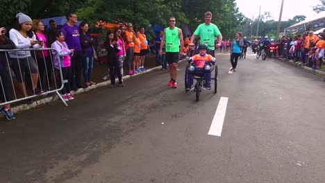 Close-take-of-disabled-athlete-in-wheel-chair-getting-ready-to-compete-on-a-inclusive-marathon