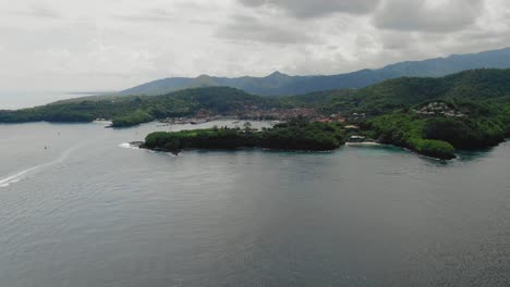 Aerial-Ferry-cruising-from-Padang-Bai-Harbor-In-Bali,-Indonesia