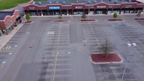 Brownstown,-Michigan---Retail-Stores-Are-Closed-And-Parking-Lots-Are-Empty-Due-To-Covid-19-Lockdown---aerial-drone-shot