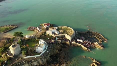 Forty-Foot,-Christmas-Swim,-Sandycove,-Ireland,-Drone-High-Establishing-Shot