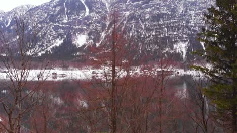 Rising-shot,-establishing-a-view-of-a-lake-in-the-Austrian-Alps,-HD-Drone