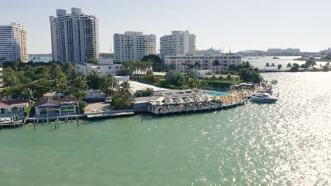 Aerial-pull-away-from-the-Standard-Spa-in-Biscayne-Bay-revealing-the-skyline-of-Miami