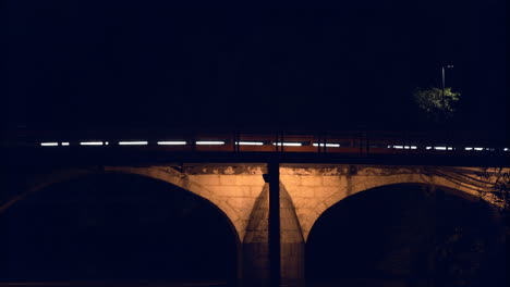 The-beautiful-lighted-bridge-over-the-Rio-Lis-River-in-Leiria,-Portugal-during-the-night---Close-up