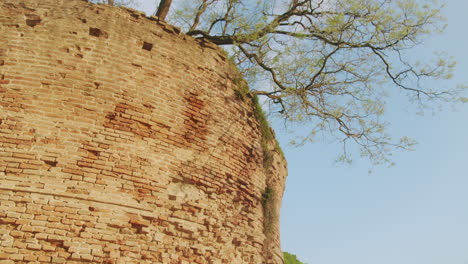 Tilt-up-on-Ferrara's-historic-city-walls-with-clear-sky-during-a-beautiful-sunny-day