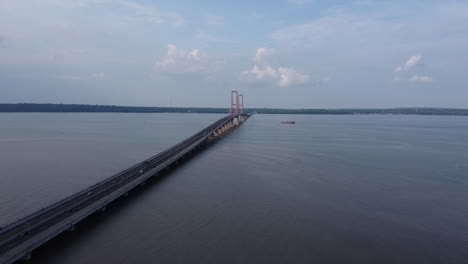 aerial-view-of-the-Suramadu-bridge,-the-longest-bridge-in-Indonesia-connecting-the-islands-of-Java-and-Madura