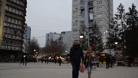 People-walking-in-pedestrian-zone-in-Mitrovica-in-Kosovo