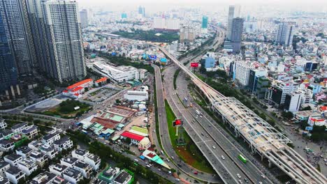 Drone-view-of-heavy-traffic-flow-on-roads-in-Ho-Chi-Minh-City,-Vietnam