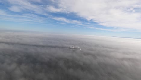 LONG-BEACH,-CA---Circa-September,-2019---An-early-foggy-aerial-view-flying-over-a-large-cruise-ship-headed-out-to-sea