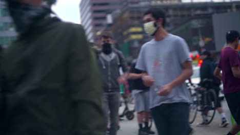 A-crowd-of-BLM-protesters-watch-police-on-the-110-highway-from-an-overpass-in-Downtown