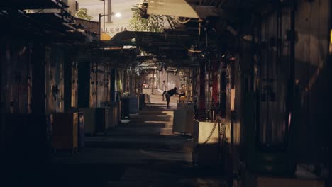 Cinematic-shot-of-a-dark-shopping-street-in-Causway-Bay,-Hong-Kong-during-the-night