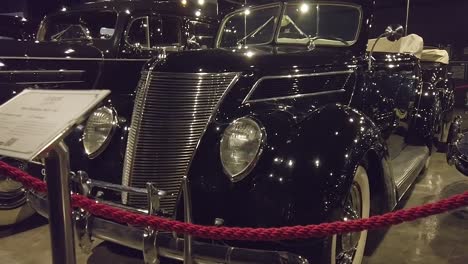 Antique-classic-vintage-black-car-at-an-auto-show-museum-in-Balneario-Camboriu,-Santa-Catarina,-Brazil