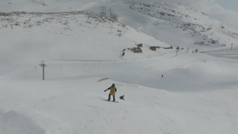 Snowboarder-jumps-from-snow-kicker-at-the-slopes-of-Mount-Hermon,-Golan-Heights,-Israel