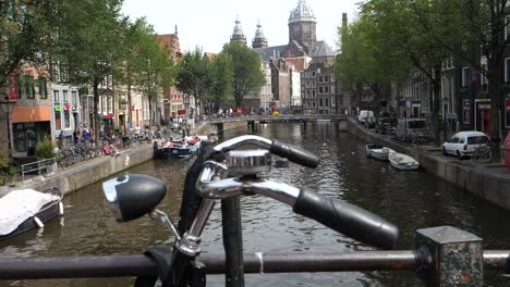 Slow-motion-footage-past-bike-on-walkway-with-canal-in-background