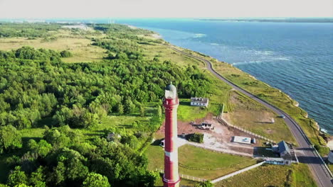 PALDISKI-DECEMBER-30:-Drone-moving-over-green-surround-Pakri-Lighthouse-in-ESTONIA-on-December-30th,2019