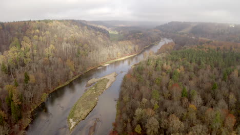 Drone-flight-above-a-wide-shallow-river-with-several-islands