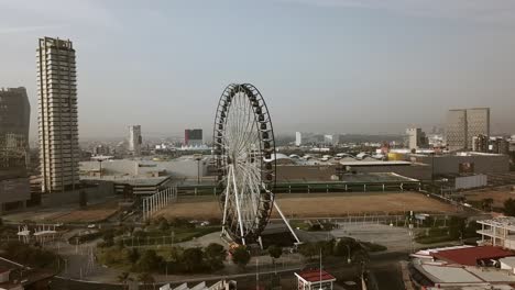 Side-view-of-the-Ferris-looking-at-the-mall-showing-logos