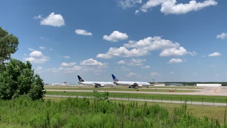 This-is-a-clip-of-aircraft-taking-off-from-George-Bush-Intercontinental-Airport,-with-unused-aircraft-in-the-foreground