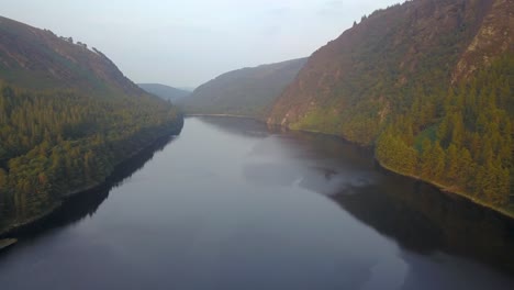 Aerial-shot-of-Glendalough-Upper-Lake-in-Wicklow-National-Park,-Ireland