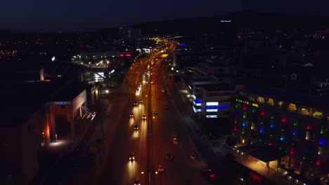 Aerial-footage-of-busy-street-with-cars-in-Athens-Greece-at-night