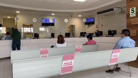 Pharmacy-Farmacia-waiting-room-and-counters-with-people-during-pandemic-COVID-times-in-Clinic-Hospital-in-Latin-America