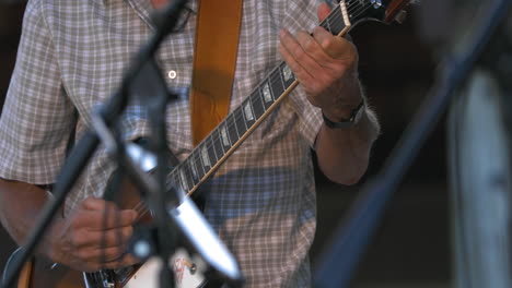 Male-electric-guitarist-performs-at-festival,-close-up-shot