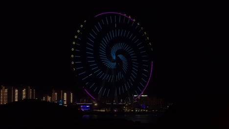 Vista-Nocturna-Del-Dubai-Eye-Con-Espectáculo-De-Luces:-La-Noria-De-Ferries-Más-Grande-Del-Mundo---4k