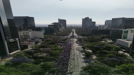 Aerial-view-vertical-mode,-March-8th-Women's-Day-march,-on-Paseo-de-la-Reforma,-CDMX